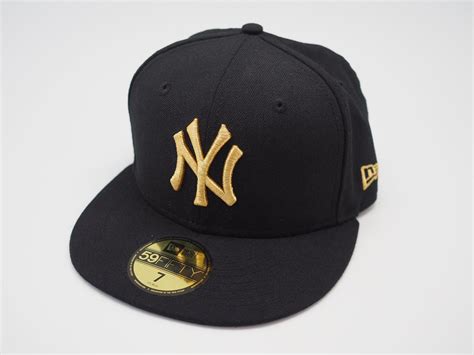 Black and gold wutx hat